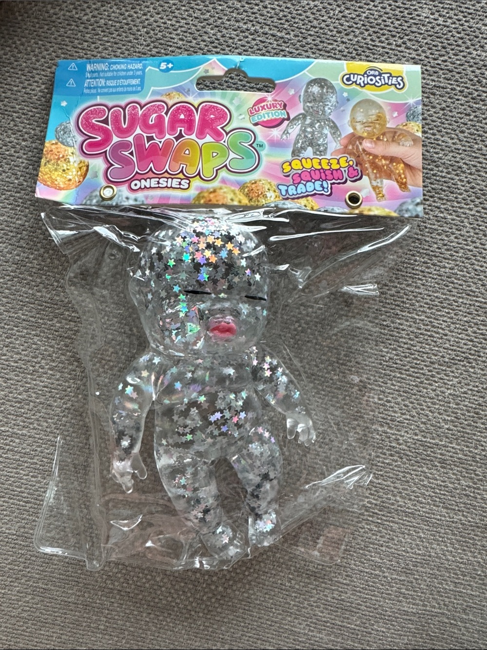 Sugar Swaps Onesies Clear Glitter Star Sensory Doll by